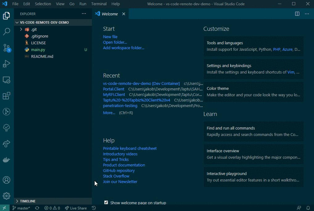 A screen capture of VS Code, opening the current workspace in a container.